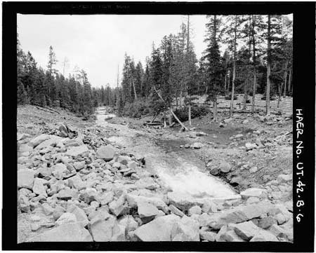 HAER photo of downstream face and dam and outlet channel, looking east, July 1985