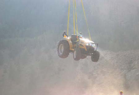 07-Clements Lake stabilization, challenger tractor being airlifted to worksite from Moon Lake staging site