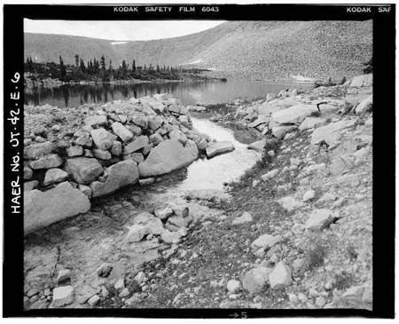 HAER photo of rock-lined spillway looking west at Drift Lake, July 1985