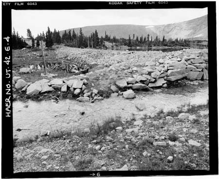 HAER photo ofdownstream face and toe of Drift Lake Dam, with spillway in foreground, looking north, July 1985