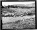 HAER photo ofdownstream face and toe of Drift Lake Dam, with spillway in foreground, looking north, July 1985