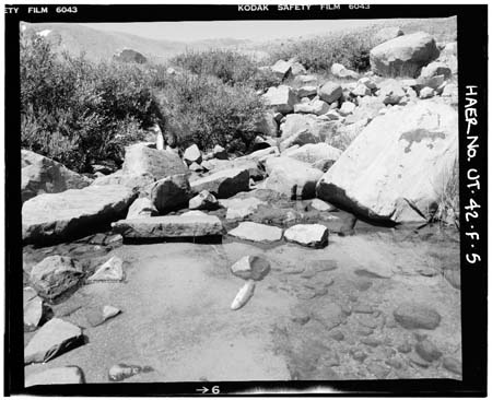HAER photo showing downstream face of East Timothy Lake Dam with outlet channel, July 1985