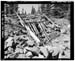 HAER photo of Farmers Lake Tunnel intake and log trash rack, looking south, July 1985