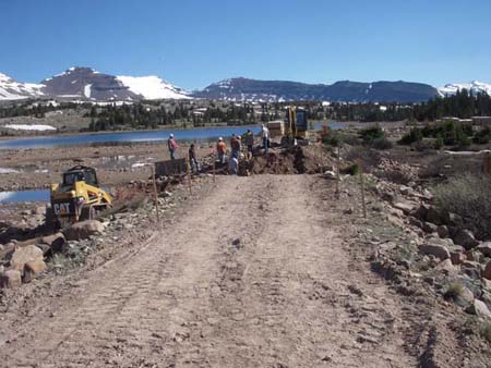 06-Five Point Lake Stabilization, cutting breach through dam