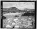 HAER photo of downstream face of Five Point Lake Dam, earth-moving scars from Dam construction in foreground, July 1985