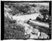 HAER photo of downstream outlet pipe and concrete collar at Five Point Lake Dam, July 1985