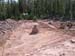 05-Island Lake Stabilization, excavating through dam embankment with center stake in place