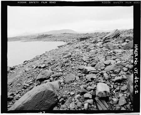 HAER photo of upstream face of Superior Lake Dam with outlet gate in background, July 1985