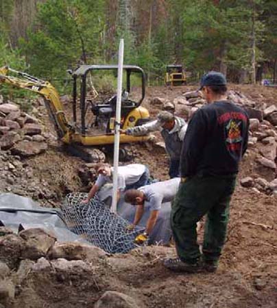 05-Water Lily Lake Stabilization, preparing gabion basket wall, rubber liner wrapped around gabion basket