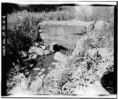 HAER photo of downstream outlet pipe and concrete collar at Water Lily Lake, July 1985