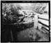 HAER photo of wood outlet weir at White Miller Lake, looking north, July 1985